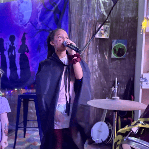 girl singing at venue in churchable